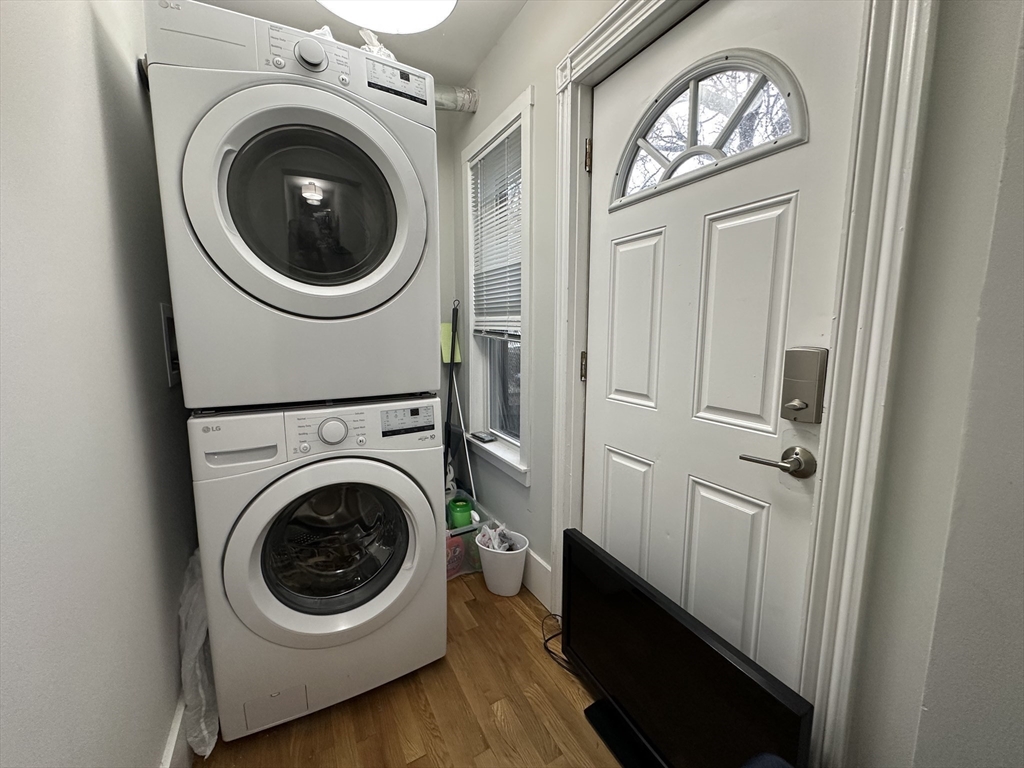 68 L Street, Unit 1 Boston, MA 02127 - Photo 7 of 12 a view of a hallway with washer and dryer