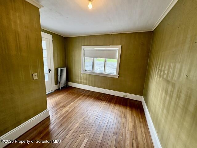 706 Delaware Street Forest City, PA 18421 - Photo 17 of 33 a view of an empty room with wooden floor and a window