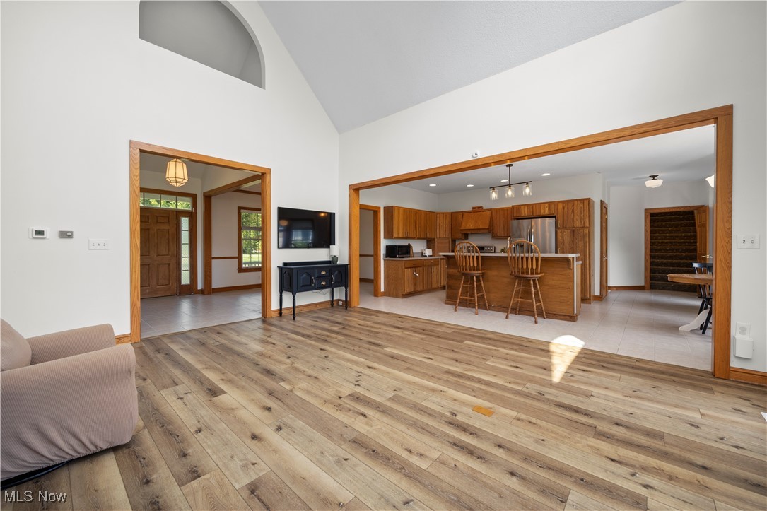 5310 Billings Road Castalia, OH 44824 - Photo 10 of 50 Great room with high vaulted ceiling and light wood-type flooring