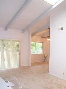 255 South Rengstorff Avenue, Unit 94 Mountain View, CA 94040 - Photo 1 of 12 an empty room with windows