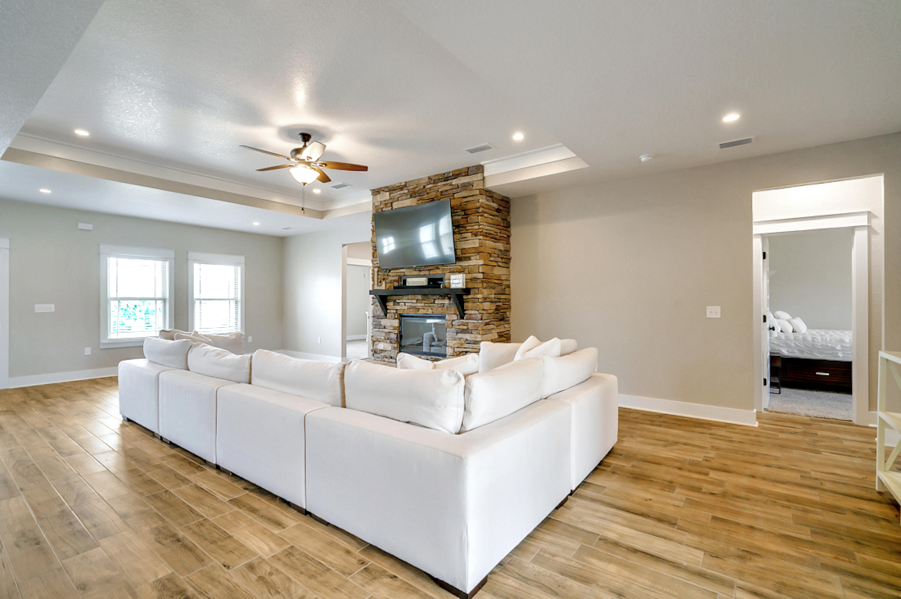4077 Happy Trails Road Crestview, FL 32539 - Photo 9 of 40 a living room with furniture and a chandelier