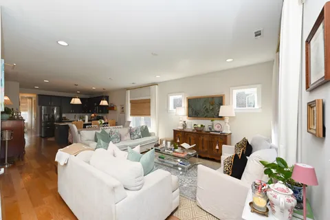 a living room with furniture fireplace and a flat screen tv