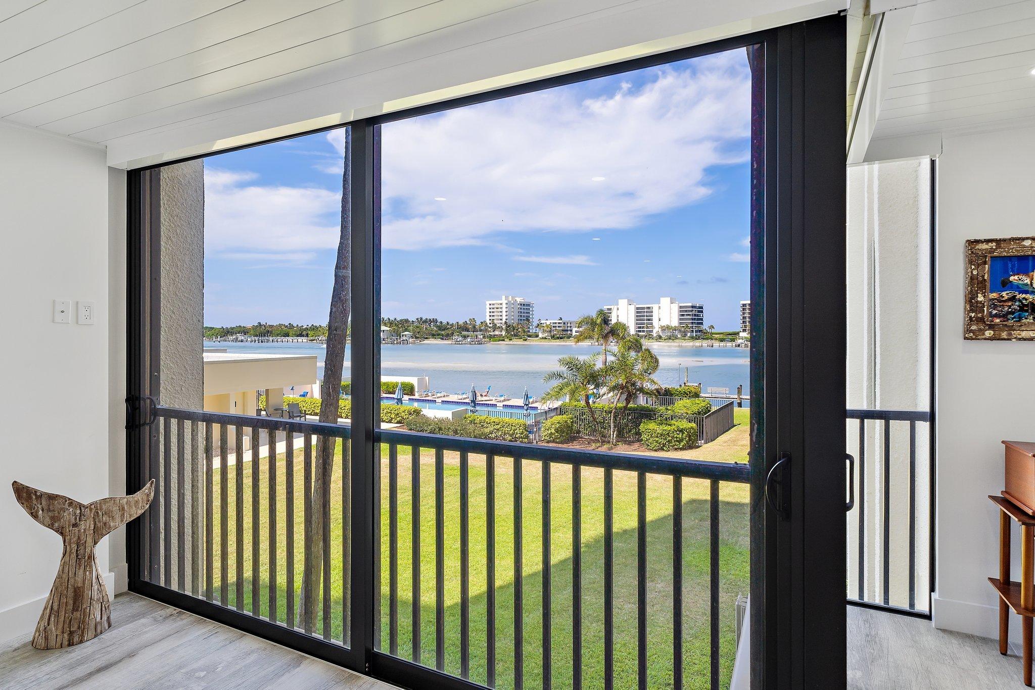 19800 Sandpointe Bay Drive, Unit 210 Jupiter, FL 33469 - Photo 11 of 59 a view of a city from a balcony