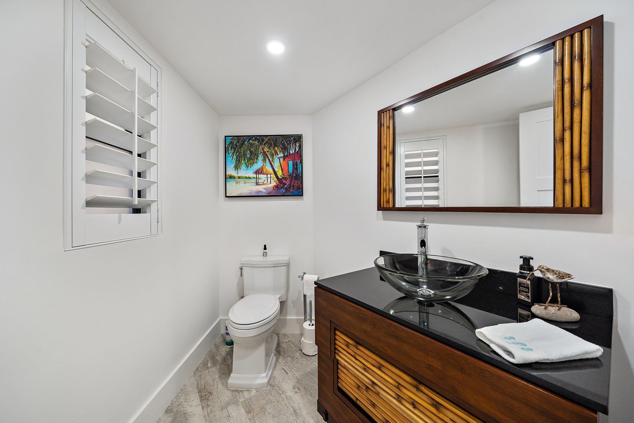 19800 Sandpointe Bay Drive, Unit 210 Jupiter, FL 33469 - Photo 17 of 59 a close view of a sink and a mirror