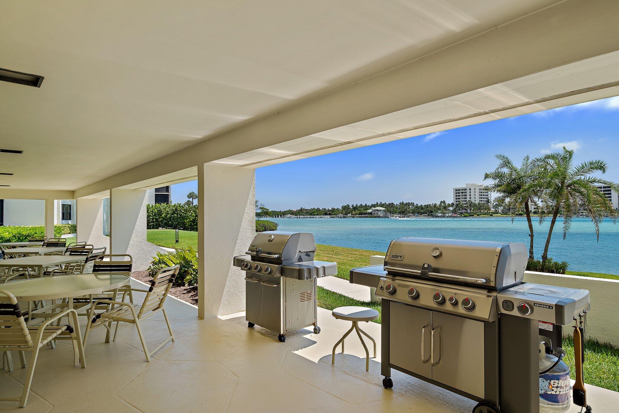19800 Sandpointe Bay Drive, Unit 210 Jupiter, FL 33469 - Photo 23 of 59 a view of a chairs and table in patio