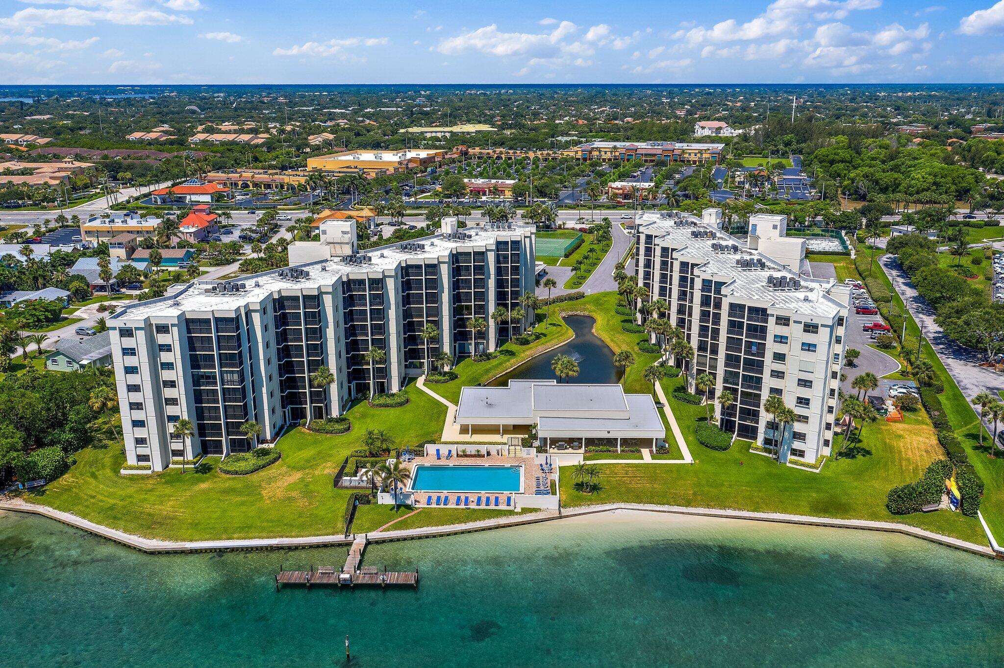 19800 Sandpointe Bay Drive, Unit 210 Jupiter, FL 33469 - Photo 4 of 59 an aerial view of residential houses with outdoor space and garden