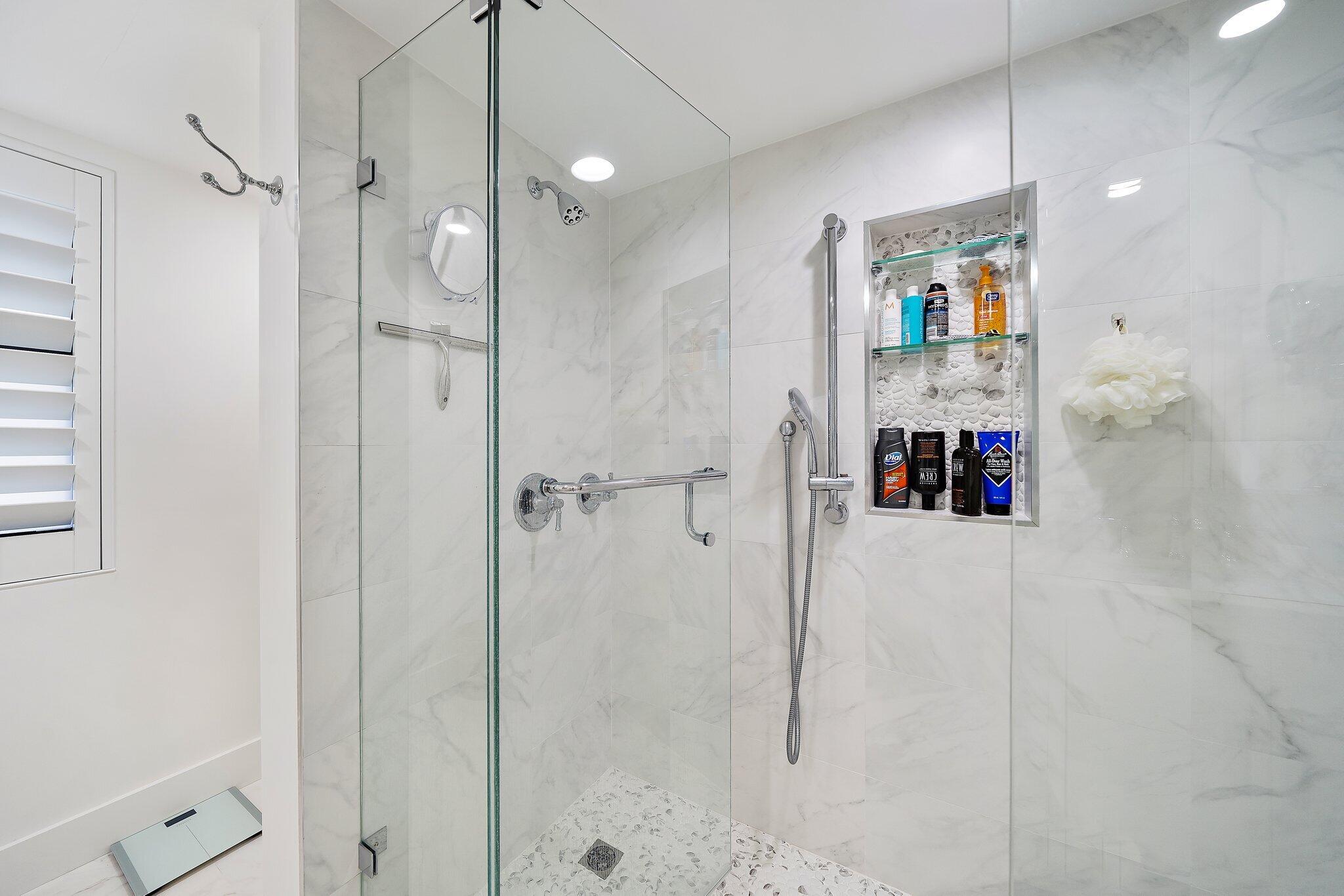 19800 Sandpointe Bay Drive, Unit 210 Jupiter, FL 33469 - Photo 45 of 59 a bathroom with a shower