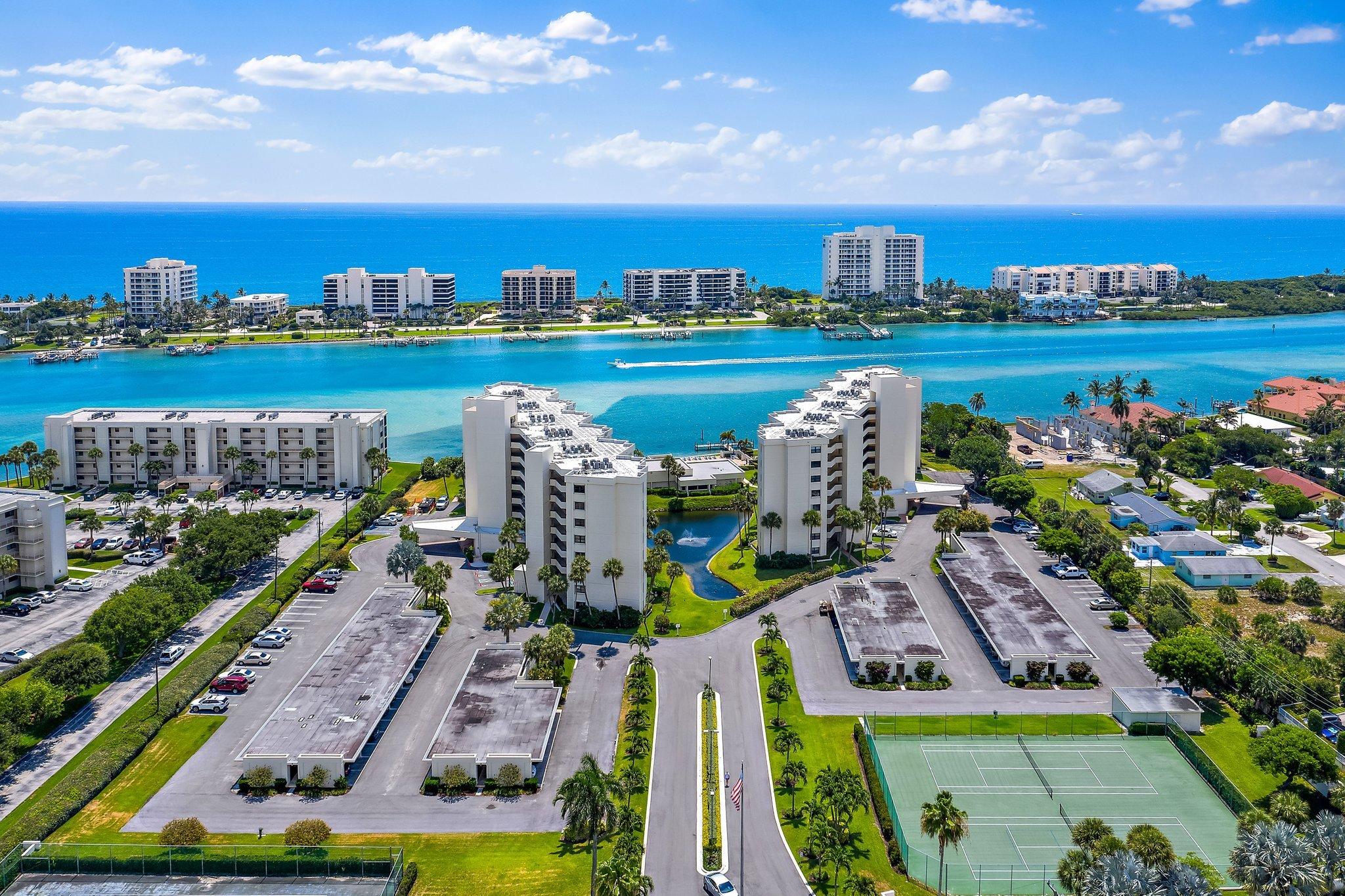 19800 Sandpointe Bay Drive, Unit 210 Jupiter, FL 33469 - Photo 51 of 59 a view of a city with lawn chairs