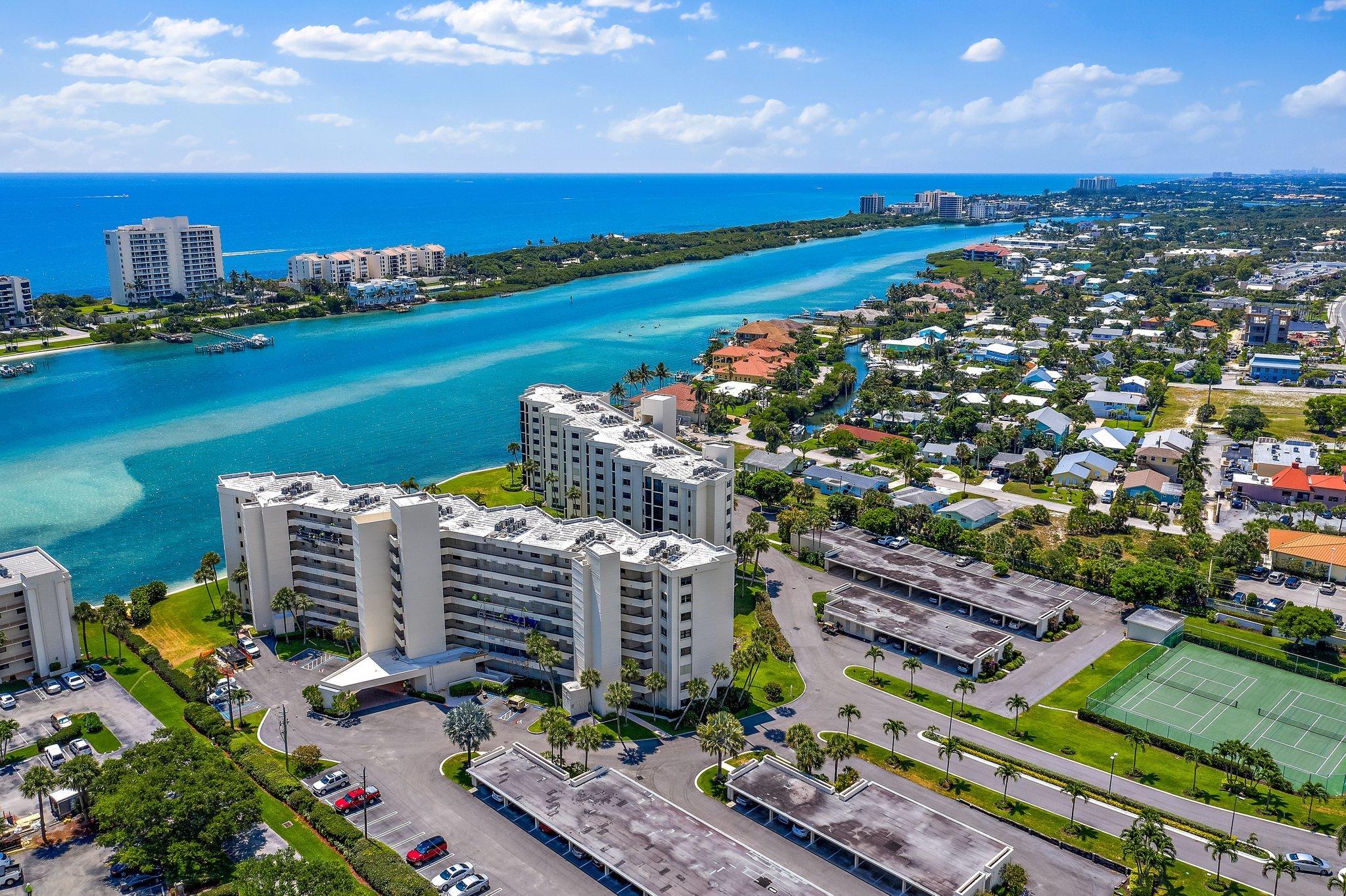 19800 Sandpointe Bay Drive, Unit 210 Jupiter, FL 33469 - Photo 55 of 59 a view of a city and an ocean