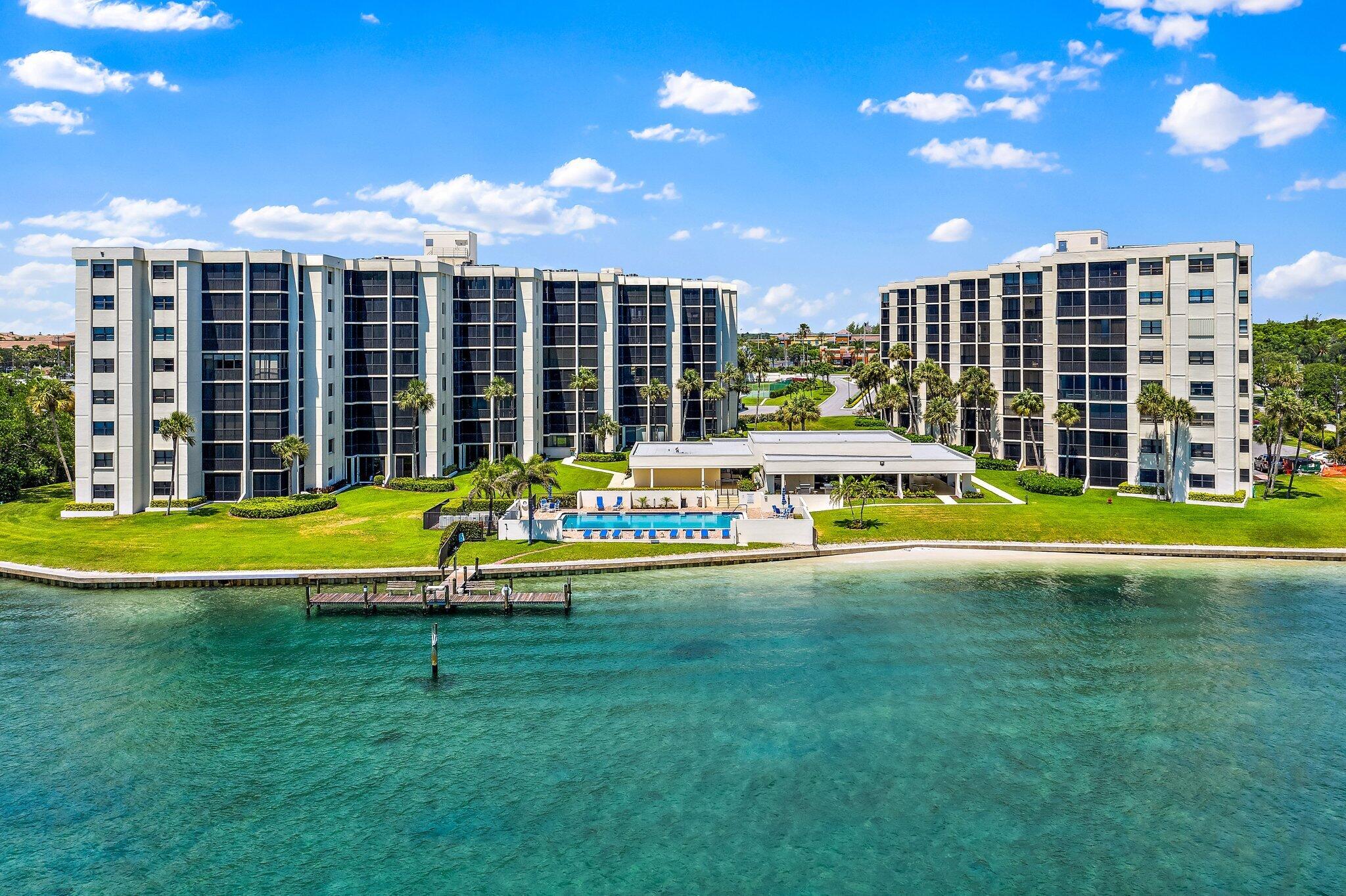 19800 Sandpointe Bay Drive, Unit 210 Jupiter, FL 33469 - Photo 57 of 59 a view of swimming pool with outdoor seating and yard