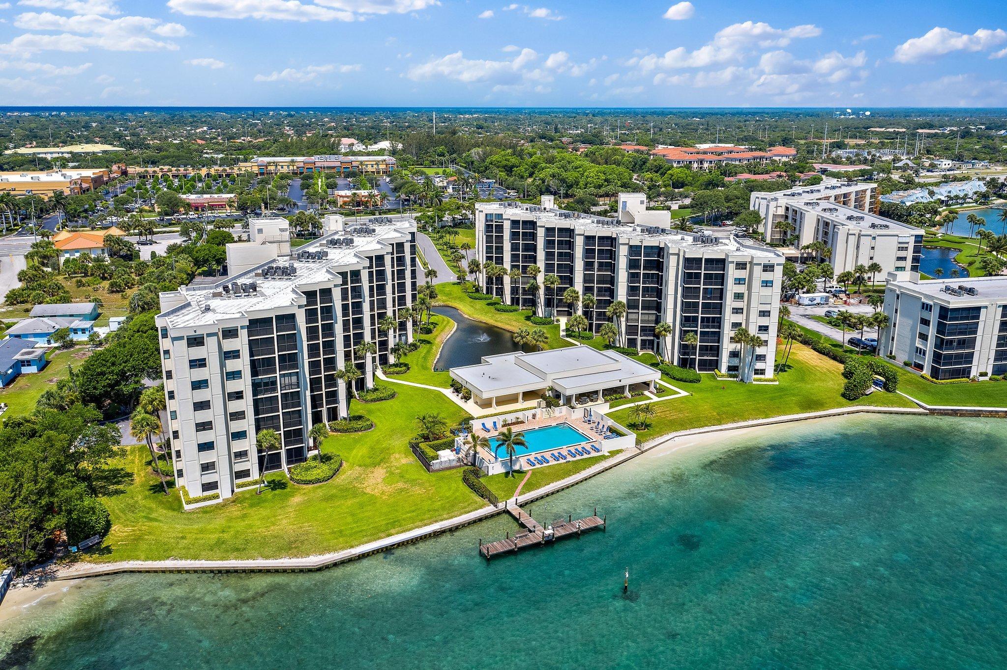19800 Sandpointe Bay Drive, Unit 210 Jupiter, FL 33469 - Photo 58 of 59 an aerial view of residential houses with outdoor space and swimming pool