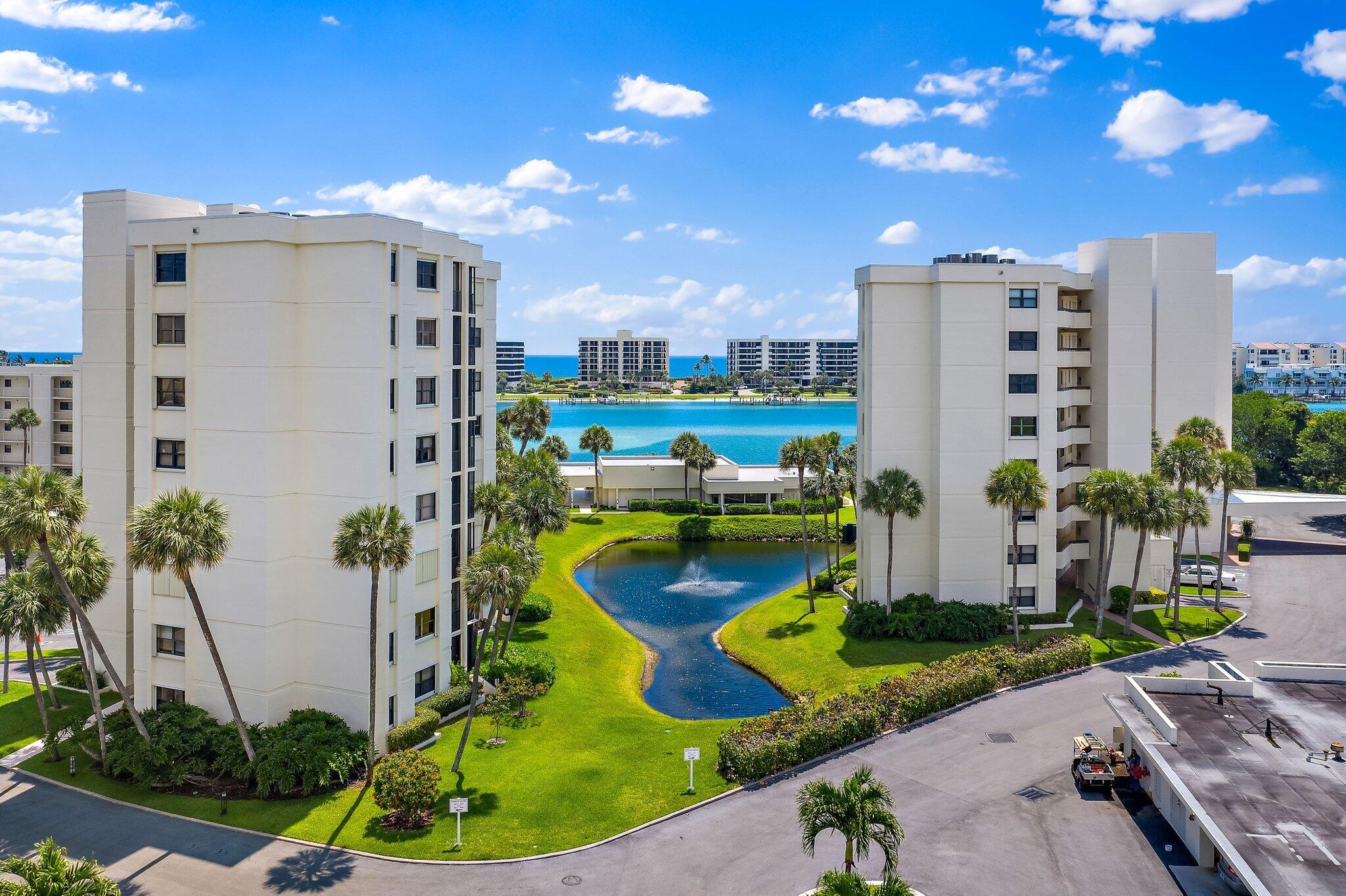 19800 Sandpointe Bay Drive, Unit 210 Jupiter, FL 33469 - Photo 59 of 59 a view of a swimming pool with a patio and plants