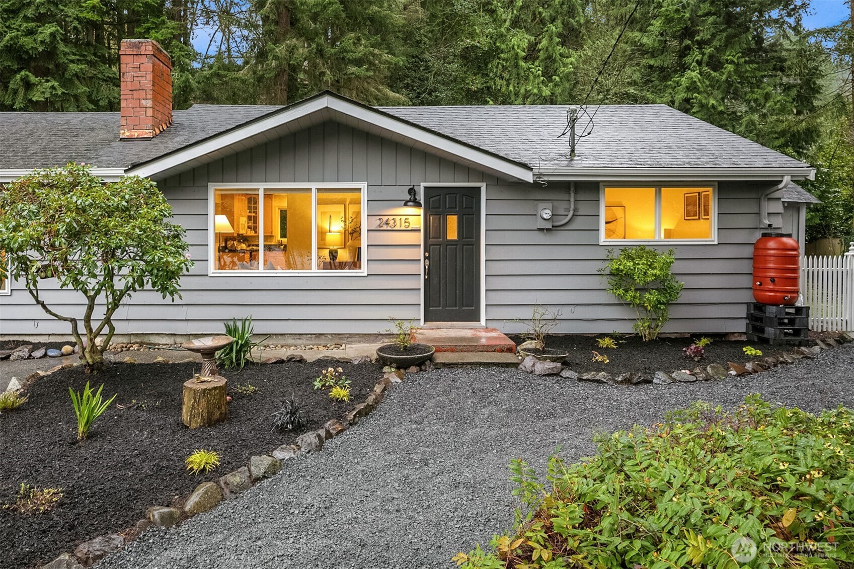a view of a house with a yard and sitting area
