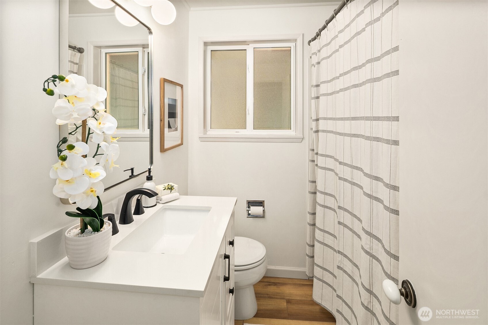 24315 104th Place West Edmonds, WA 98020 - Photo 21 of 29 a bathroom with a sink a toilet and shower curtain