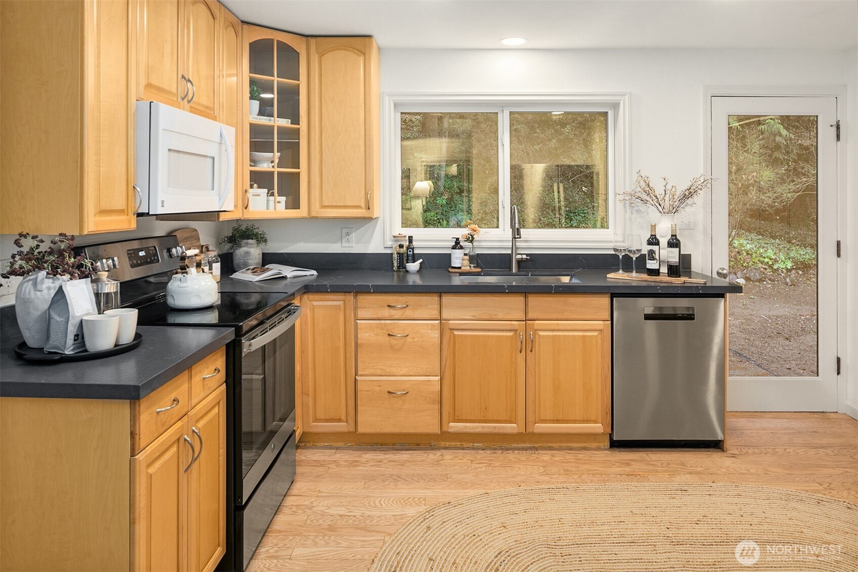 24315 104th Place West Edmonds, WA 98020 - Photo 9 of 29 a kitchen with a sink and a window