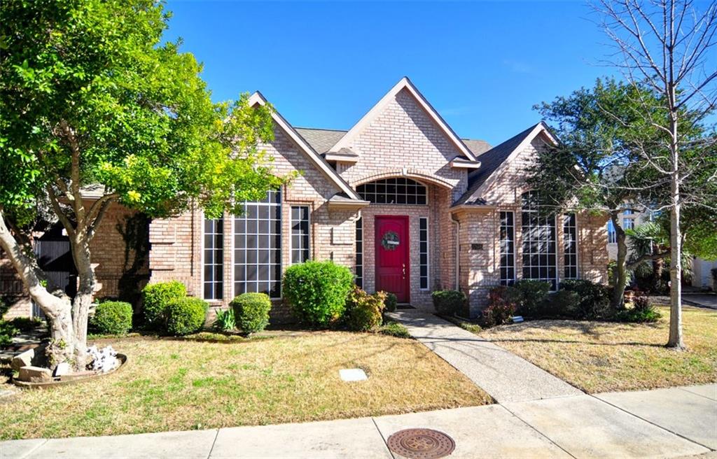 17608 Windflower Way Dallas, TX 75252 - Photo 1 of 1 a front view of a house with garden