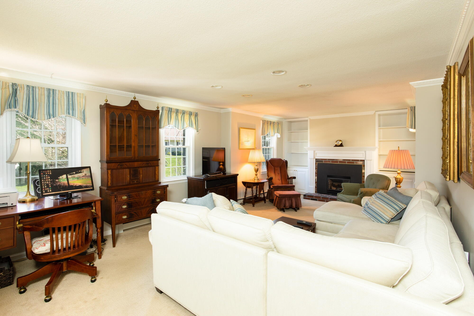 91 Hawser Bend Centerville, MA 02632 - Photo 11 of 42 a living room with furniture fireplace and flat screen tv