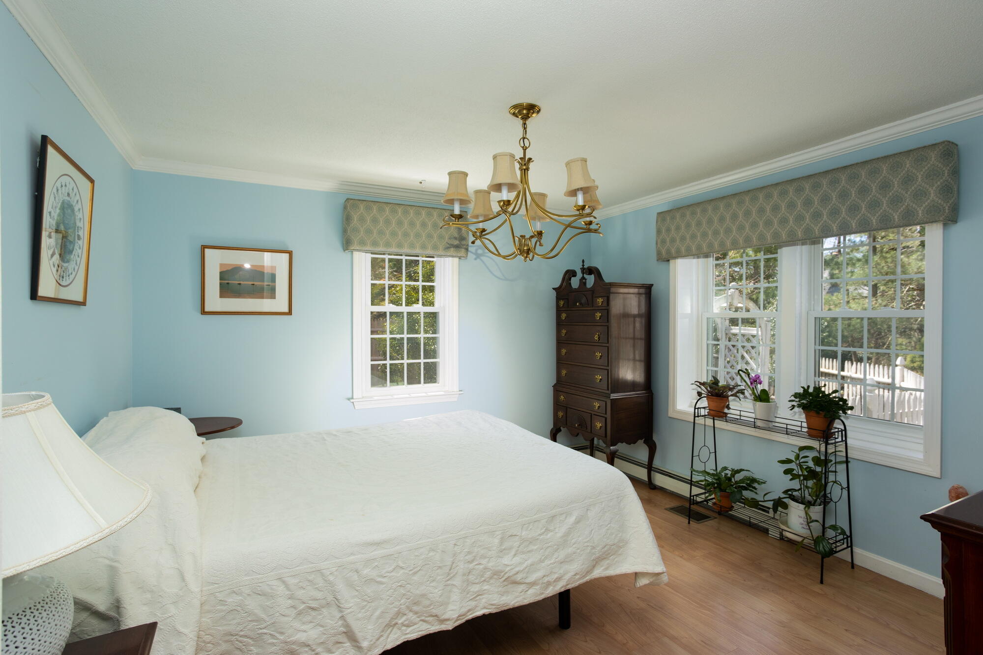 91 Hawser Bend Centerville, MA 02632 - Photo 14 of 42 a spacious bedroom with a bed and a large window