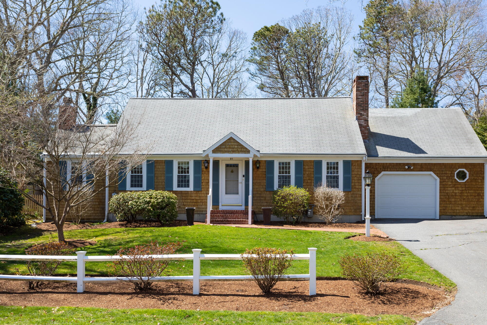 91 Hawser Bend Centerville, MA 02632 - Photo 2 of 42 a front view of a house with garden
