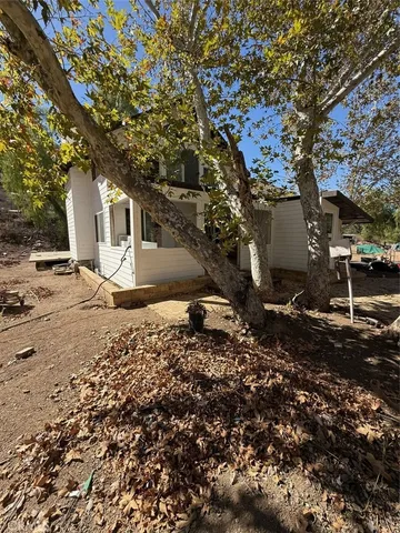 a view of a house with a snow on the road