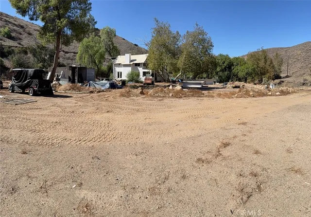 a kitchen with a stove a refrigerator and cabinets
