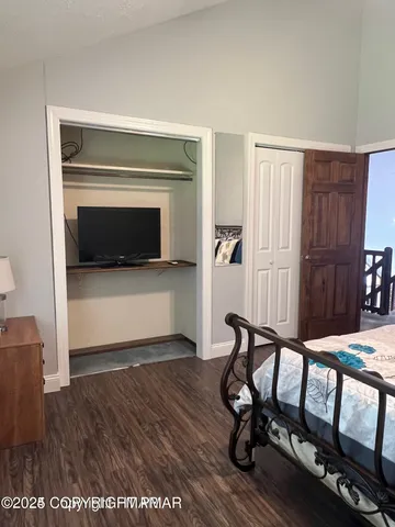 a bedroom with a bed and a table in it