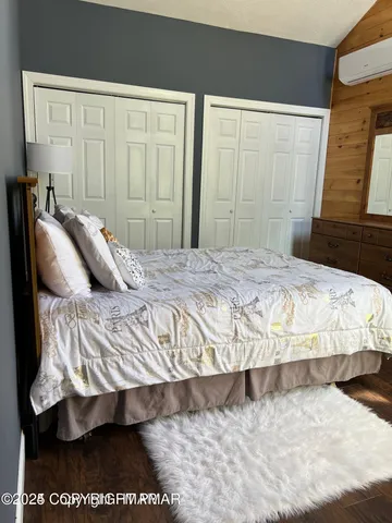 a bedroom with a bed and a lamp