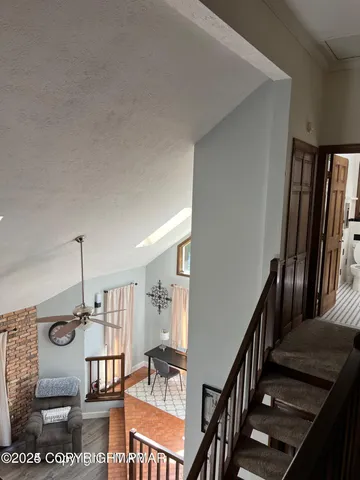 a kitchen with a table chairs and a wooden floor