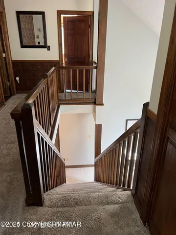 a large kitchen with stainless steel appliances granite countertop a stove a sink dishwasher and a refrigerator