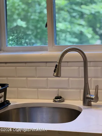 a view of a kitchen with electric appliances