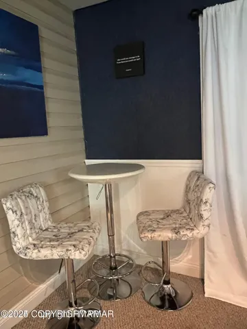 a view of a deck with wooden floor and fence