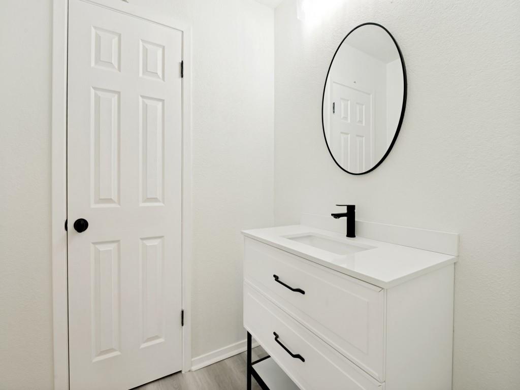2240 Tarpley Road, Unit 92 Carrollton, TX 75006 - Photo 17 of 22 a bathroom with a sink and a mirror