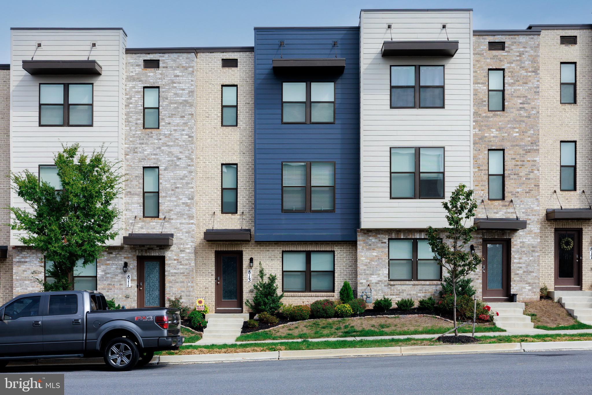 a car parked in front of a brick building