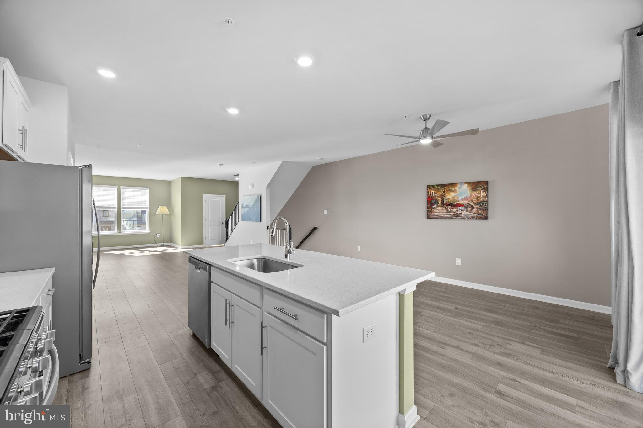 813 Bond Street Frederick, MD 21701 - Photo 14 of 46 a view of a kitchen with a sink and wooden floor