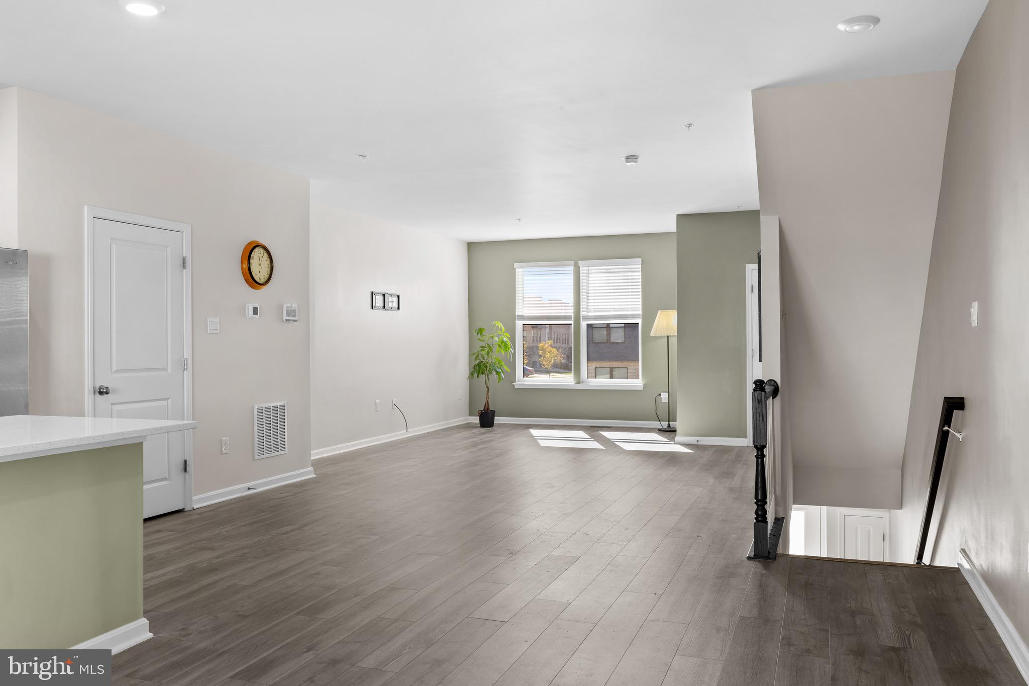 813 Bond Street Frederick, MD 21701 - Photo 18 of 46 a view of an empty room with wooden floor and a window