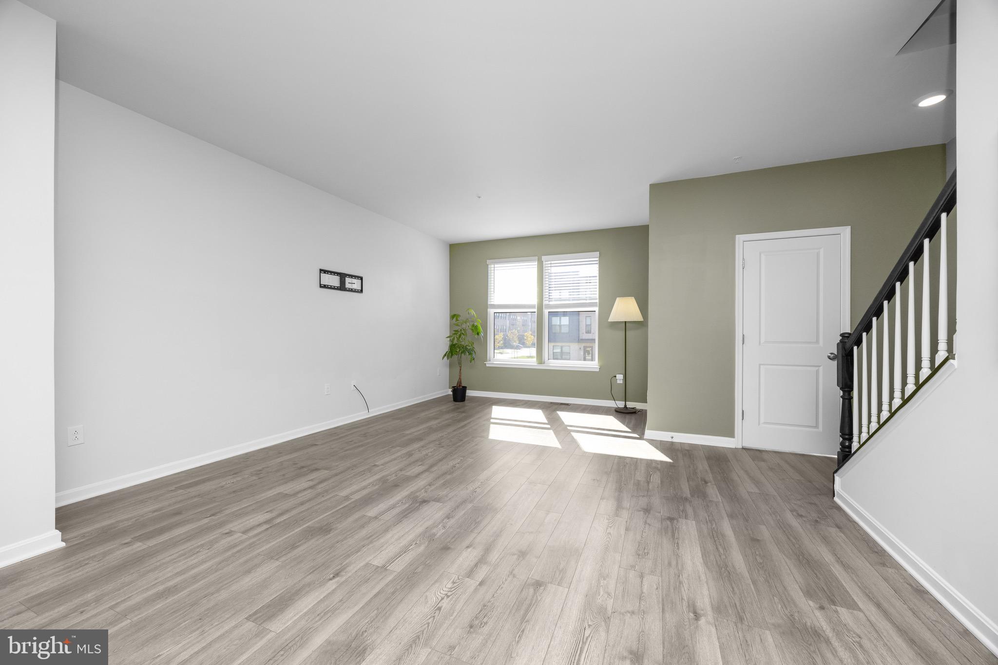 813 Bond Street Frederick, MD 21701 - Photo 21 of 46 wooden floor in an empty room with a window