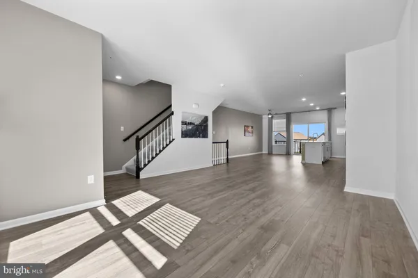 a view of a living room and wooden floor