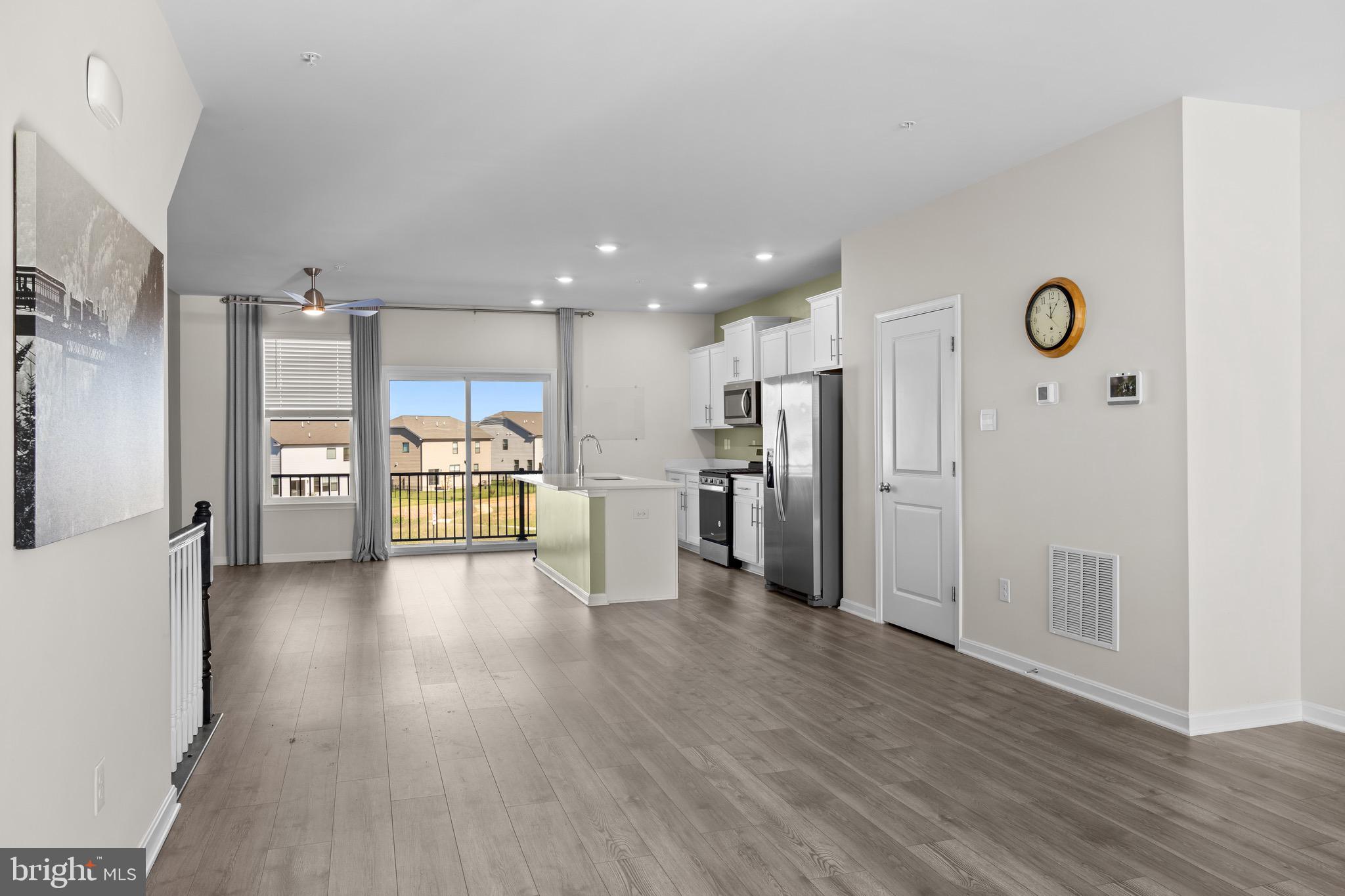 813 Bond Street Frederick, MD 21701 - Photo 24 of 46 a view of a kitchen with refrigerator and wooden floor