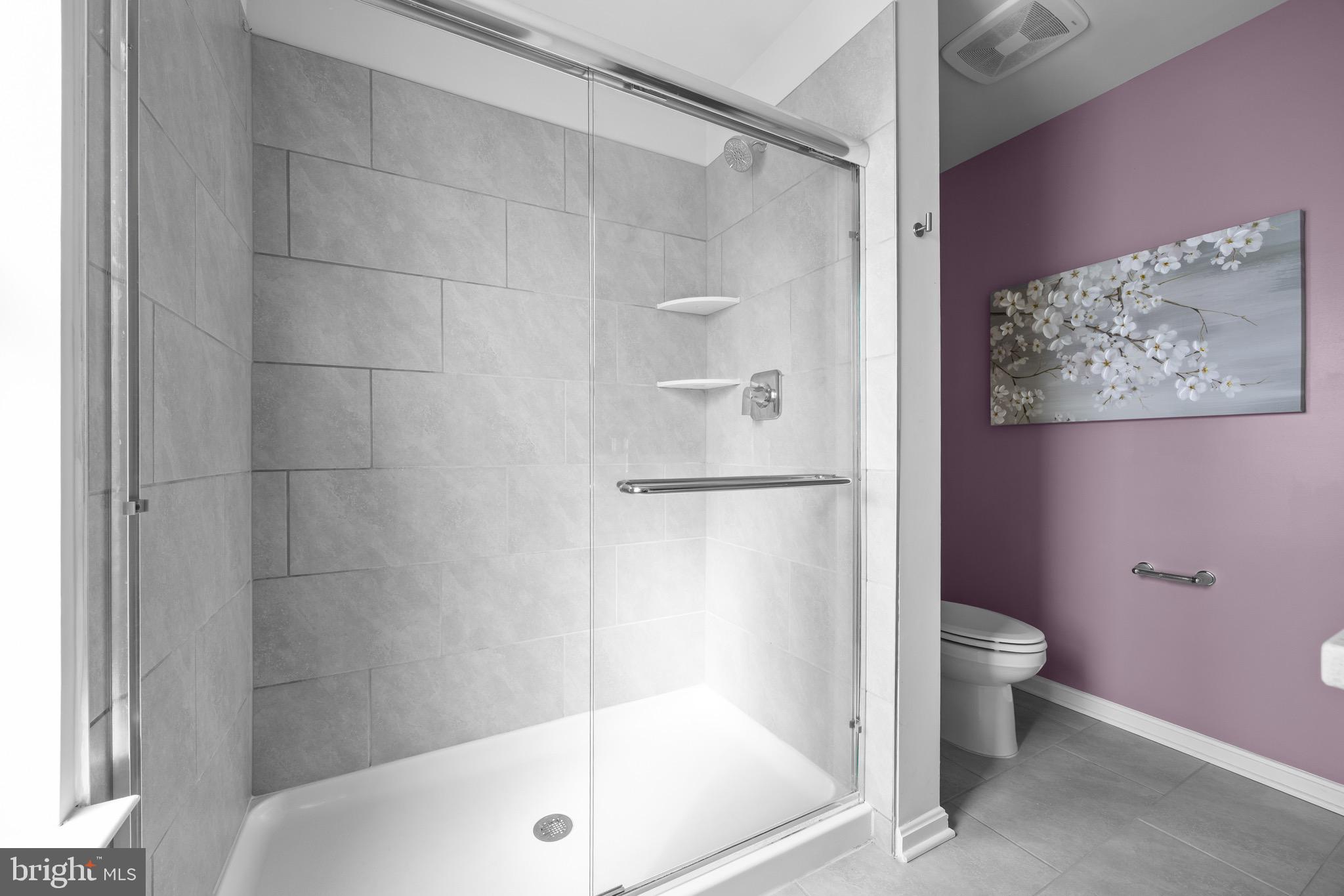 813 Bond Street Frederick, MD 21701 - Photo 29 of 46 a bathroom with a bathtub and a toilet