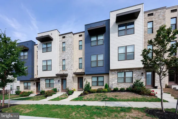 a front view of a building with garden