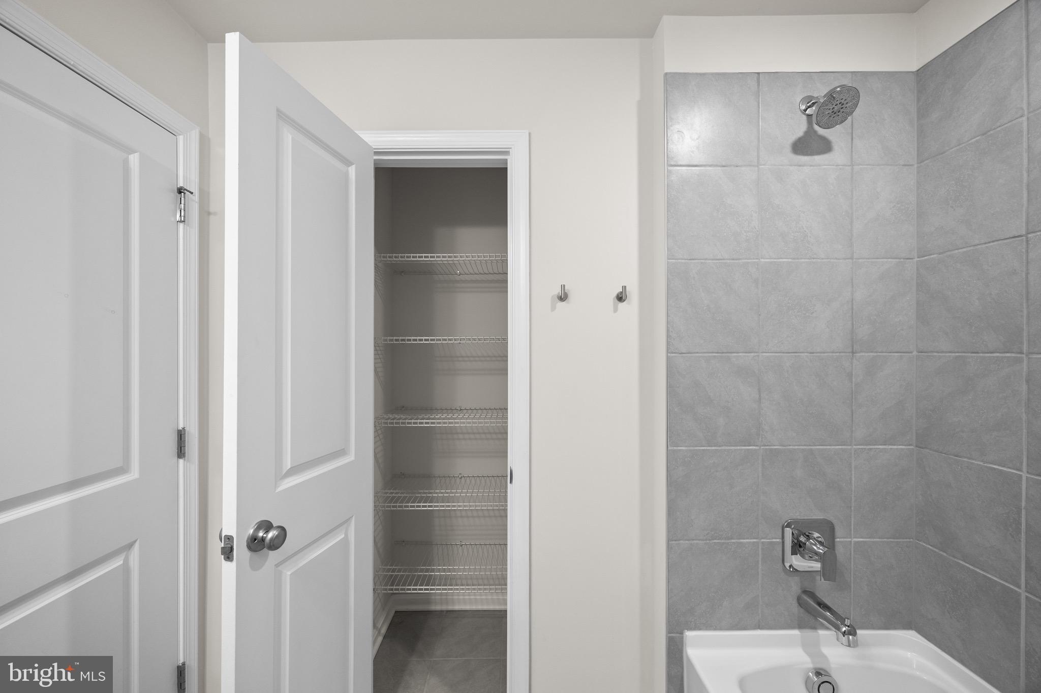 813 Bond Street Frederick, MD 21701 - Photo 34 of 46 a bathroom with a bathtub