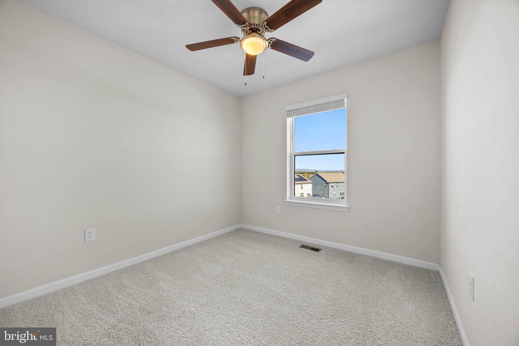 813 Bond Street Frederick, MD 21701 - Photo 36 of 46 an empty room with windows and fan