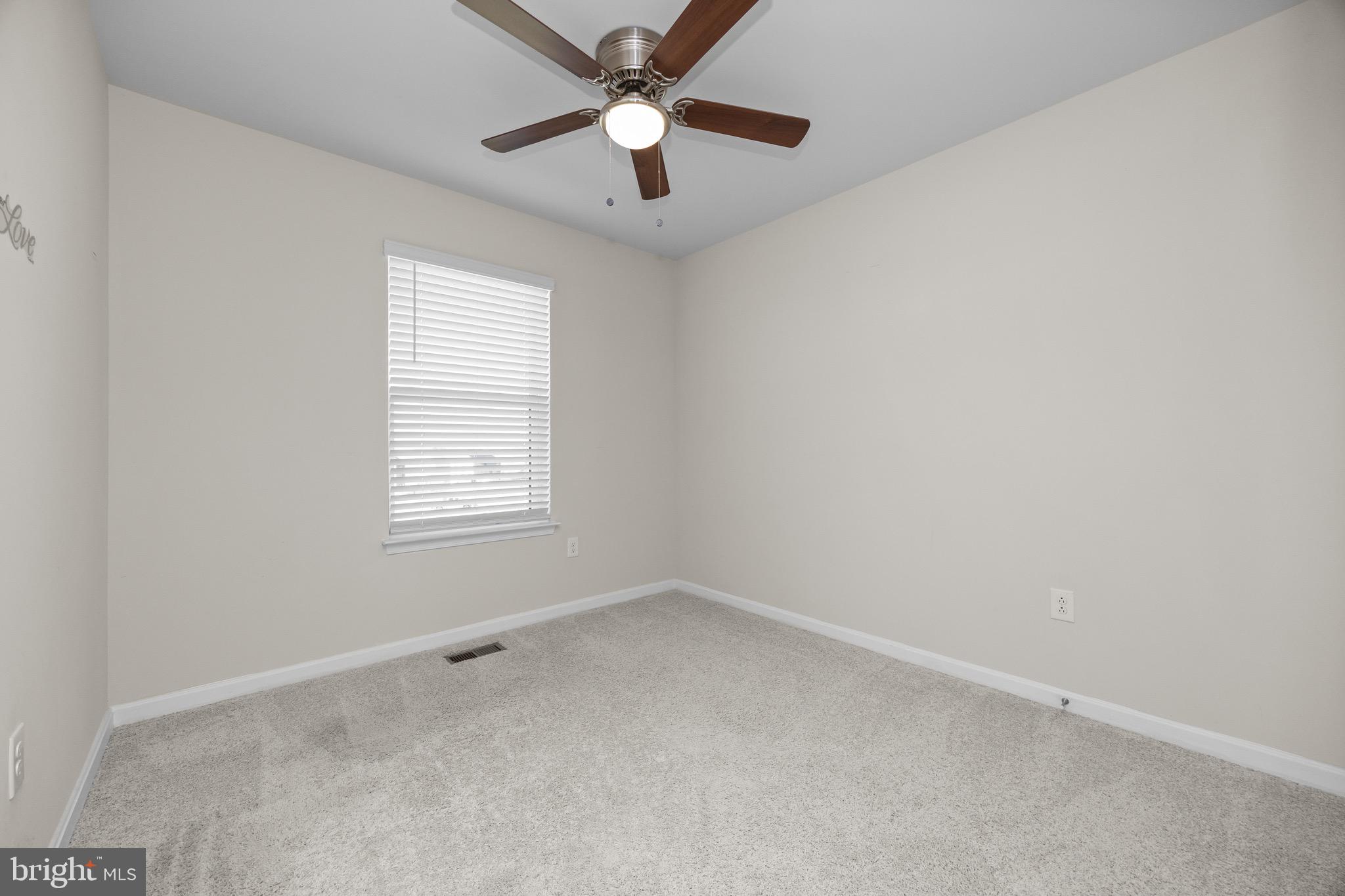 813 Bond Street Frederick, MD 21701 - Photo 39 of 46 an empty room with a window and a fan