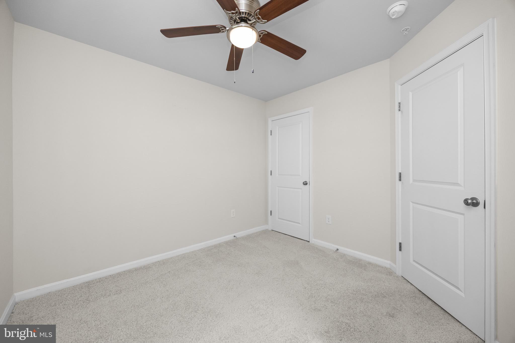 813 Bond Street Frederick, MD 21701 - Photo 40 of 46 an empty room with a ceiling fan and fan