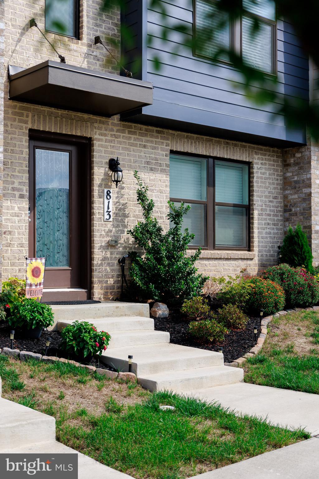 813 Bond Street Frederick, MD 21701 - Photo 5 of 46 a front view of a house with a yard