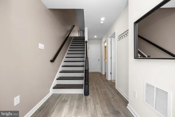 a view of entryway with wooden floor