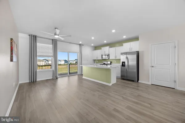 a view of kitchen with wooden floor
