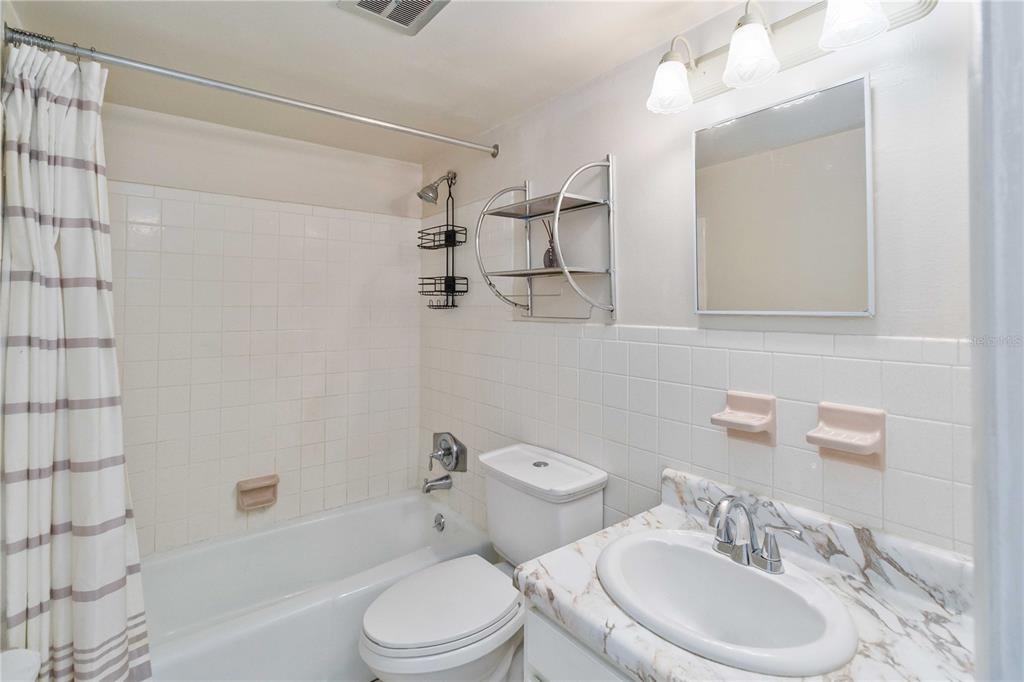 2500 Lee Road, Unit 244 Winter Park, FL 32789 - Photo 19 of 26 a bathroom with a sink a toilet and shower