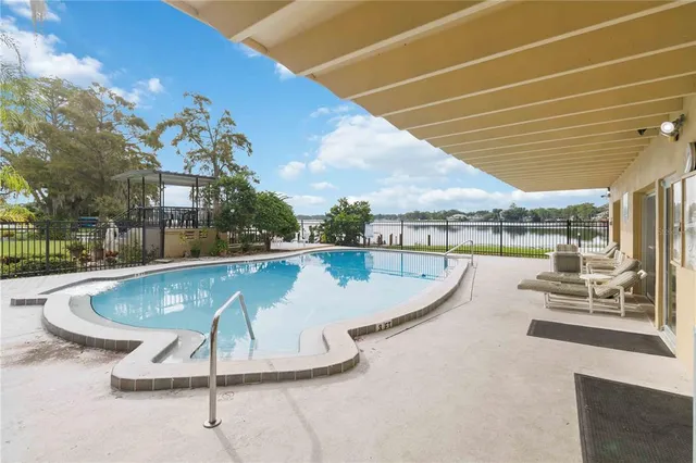 a view of a swimming pool with a patio