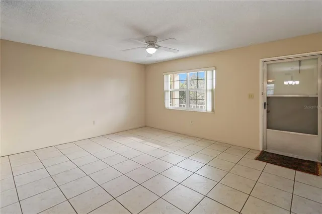 a view of an empty room and window